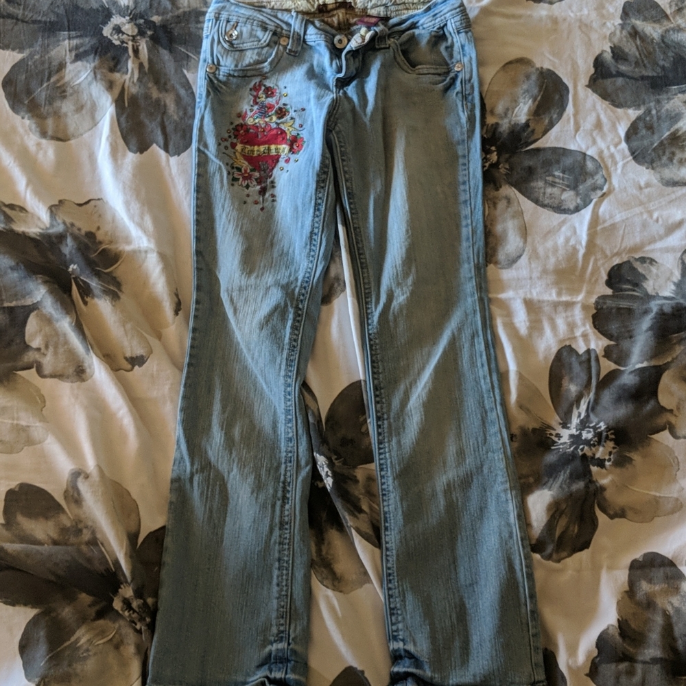 Jeans with dagger thru heart design